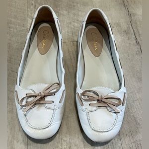White and pink leather flats
